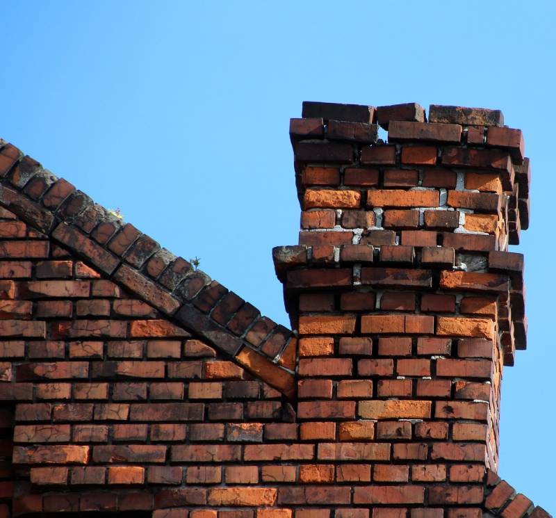 Signs Your Aberdeen Home Needs a Chimney Inspection Damaged chimney on an Aberdeen home showing cracks and missing mortar